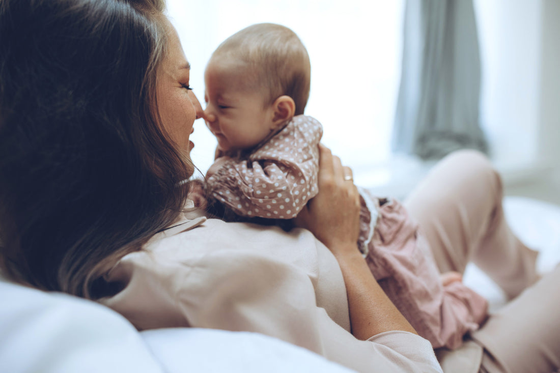 Woman with a baby. Beautiful mother with a baby.
