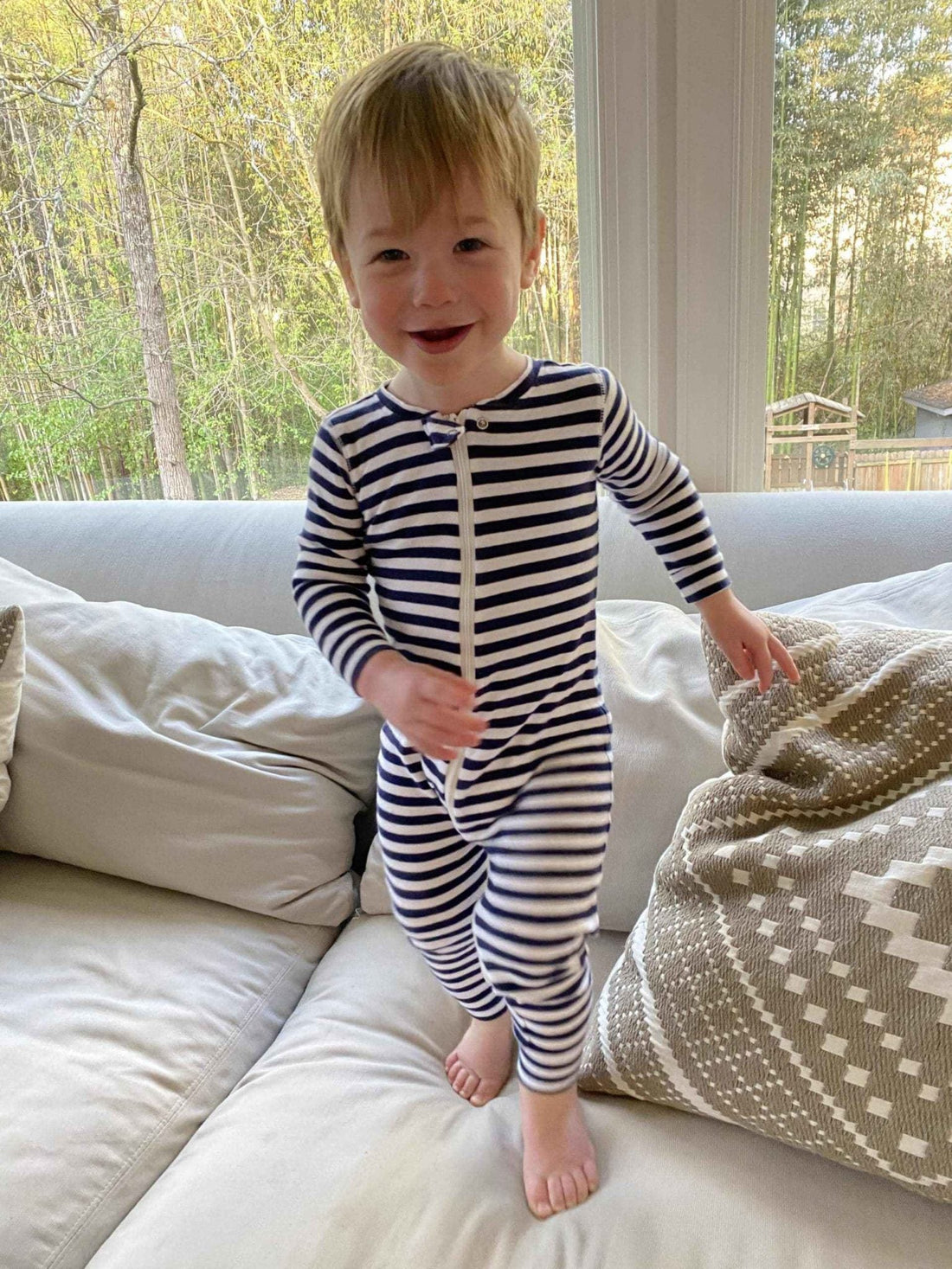 toddler playing on couch