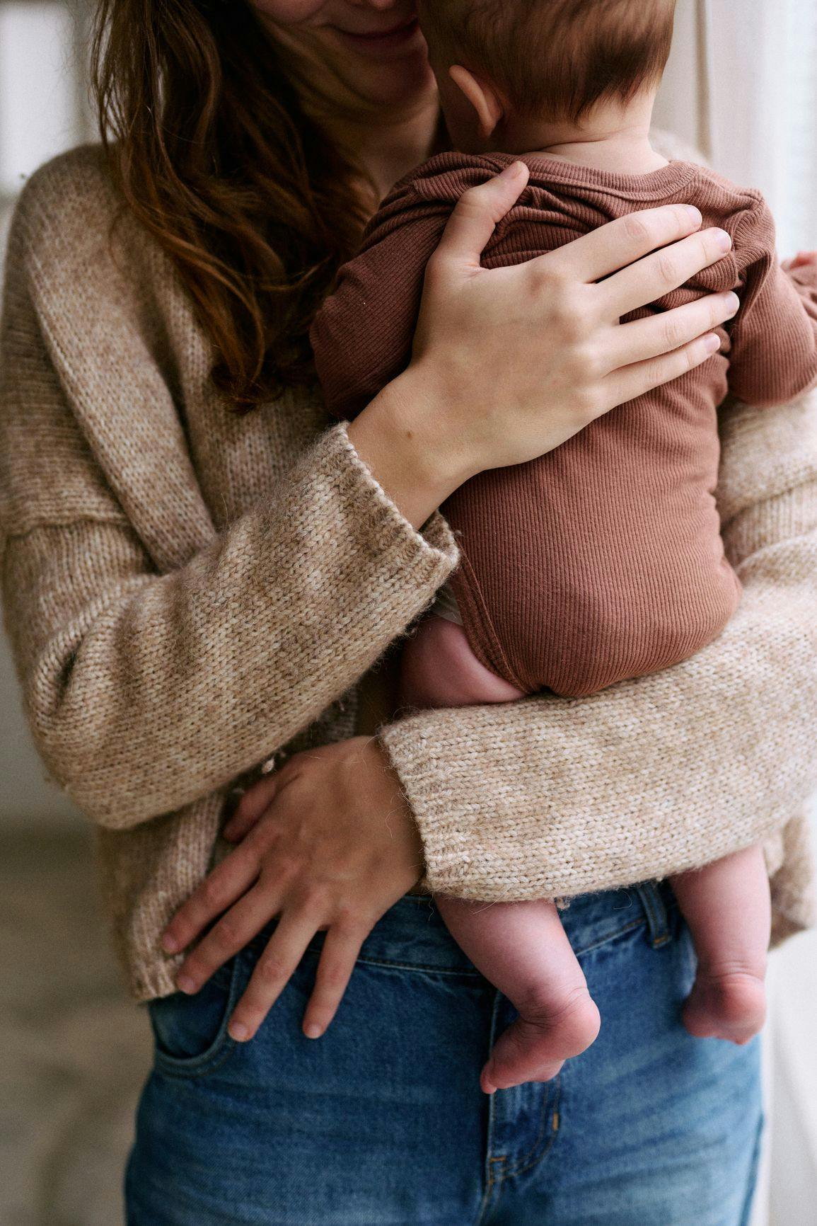 Mother holding her child