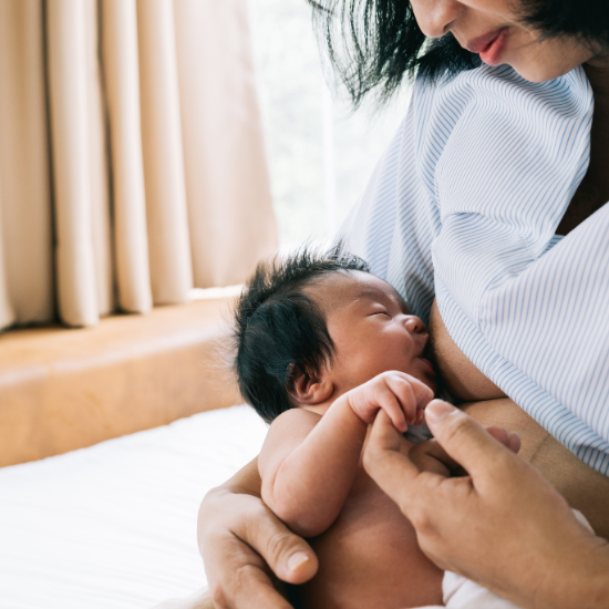 a mom breastfeeding her baby