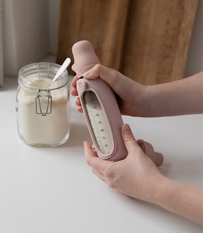 Woman using a bottle sleeve 2