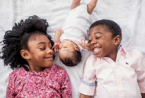 Two toddlers and a baby