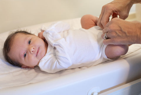 Baby smiles after having her diaper changed