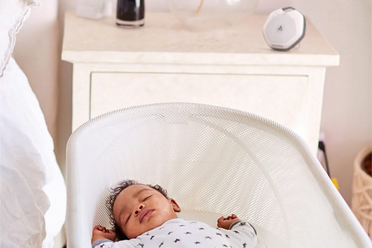 Baby peacefully sleeping in a crib 2