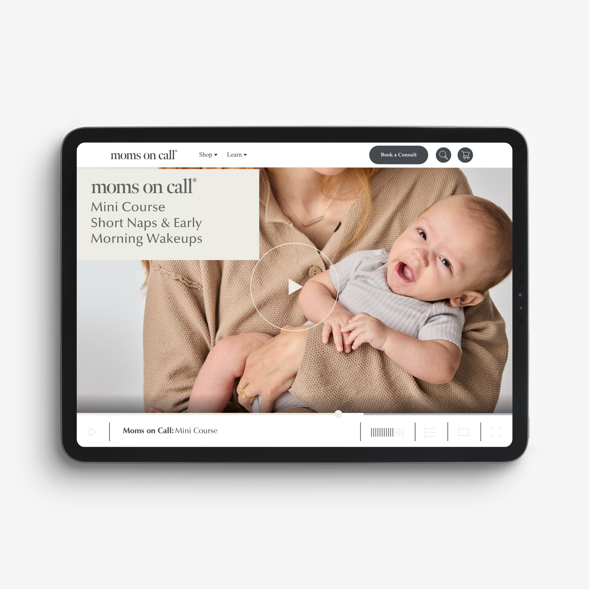 Tablet displaying moms on call mini online course for short naps and early morning wakeups with a baby and mother on the screen