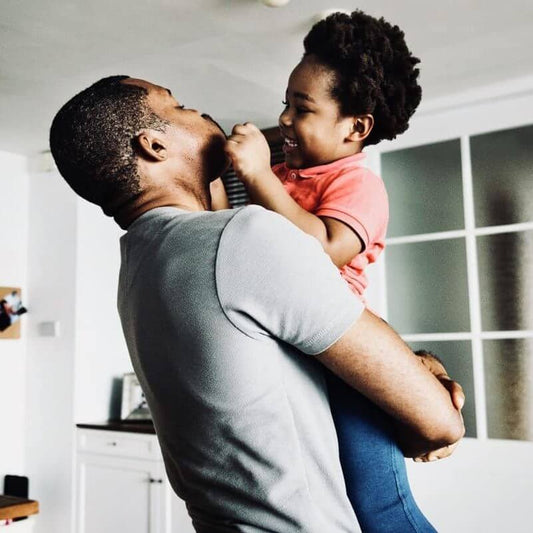 dad holding toddler