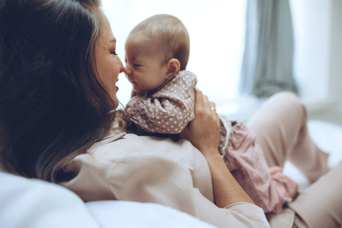 Woman with a baby. Beautiful mother with a baby.