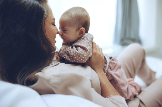 Woman with a baby. Beautiful mother with a baby.