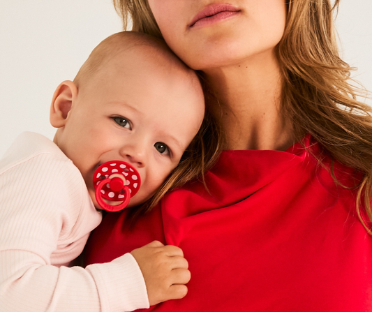 mom holding baby