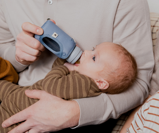 dad feeding baby 