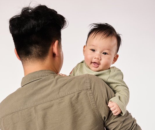 dad holding baby