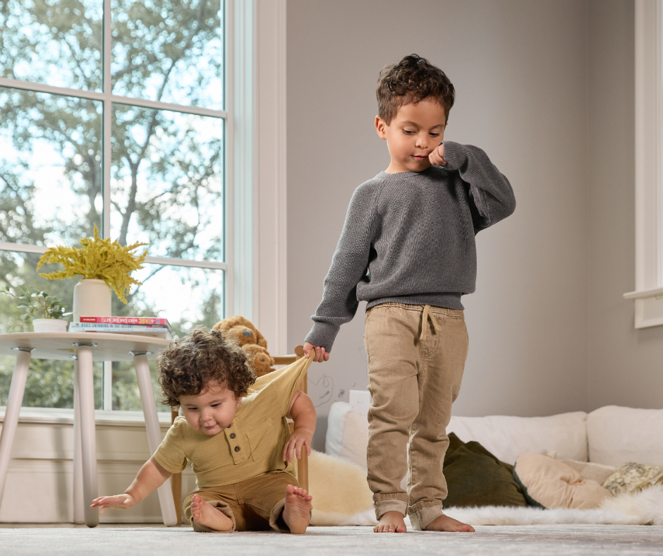 toddler and his brother playing
