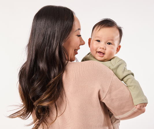 mom holding baby
