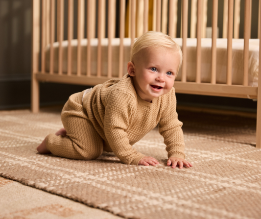 baby crawling in nursery