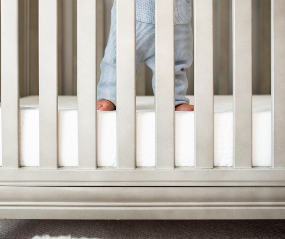baby standing in crib