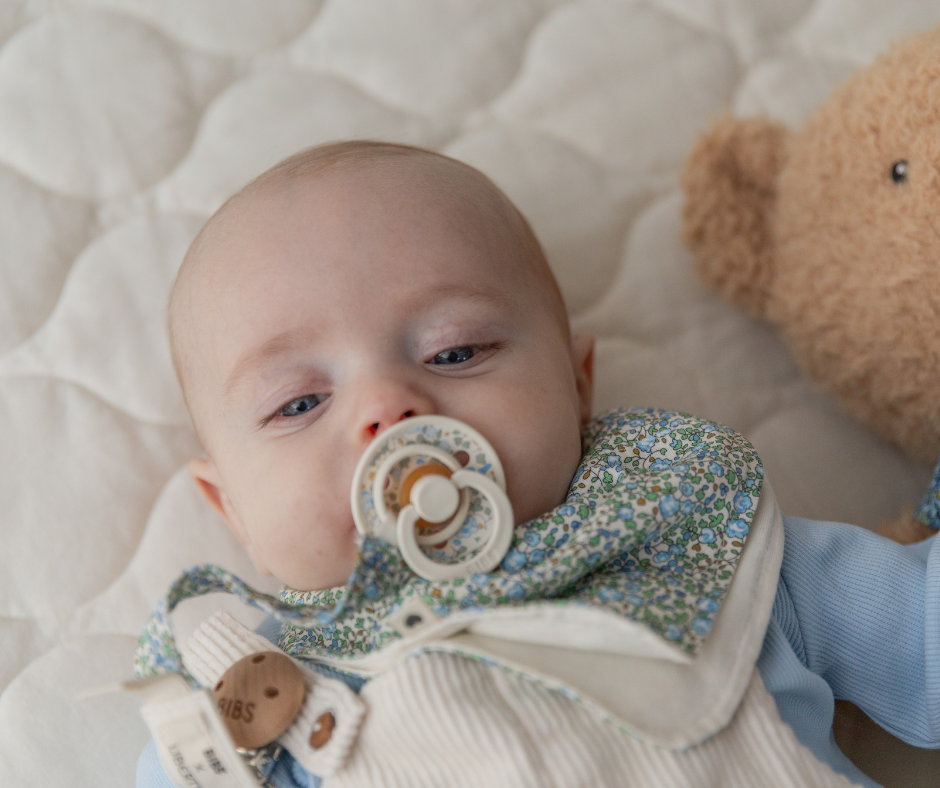 baby with bibs pacifier