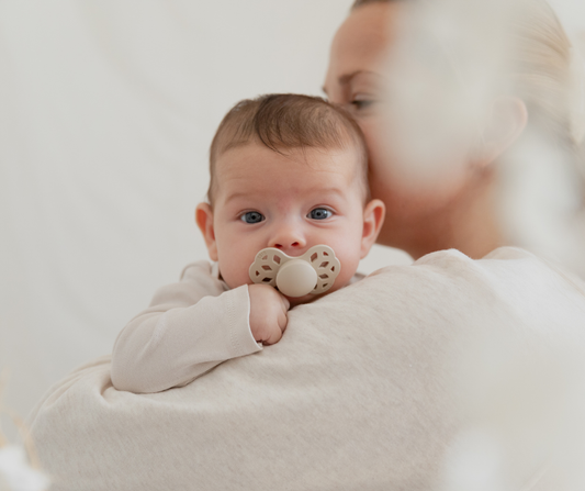 mom holding baby