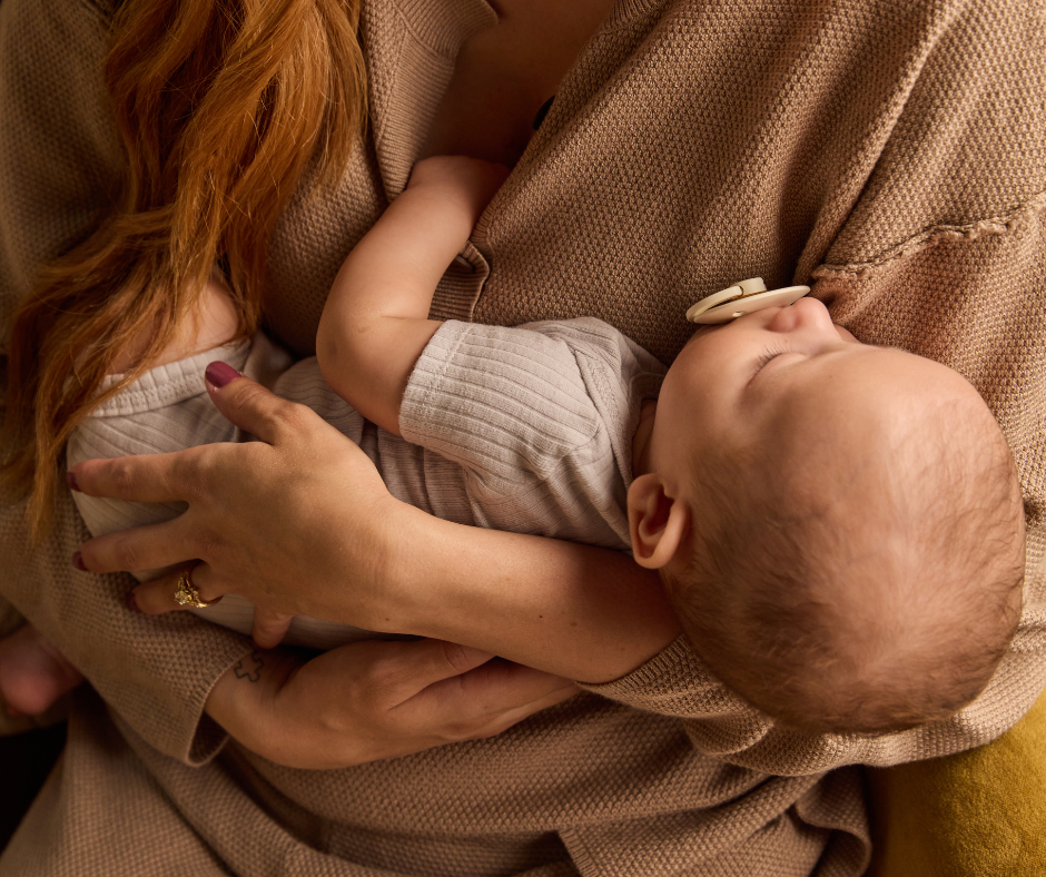 mom holding baby