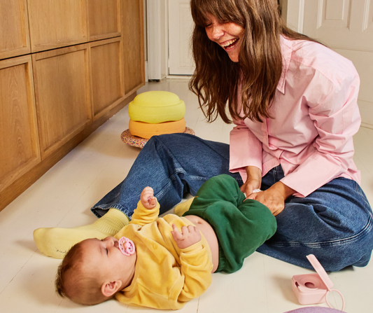 mom playing with baby