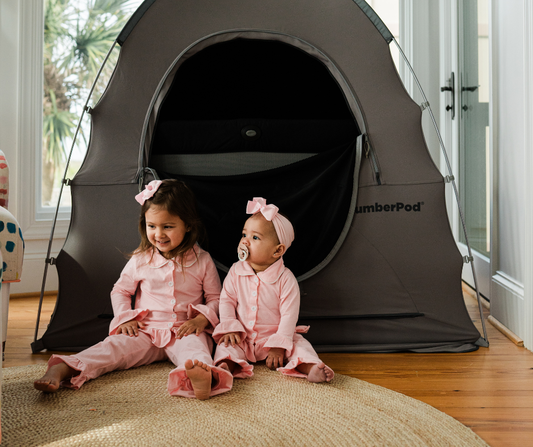 baby and toddler sitting together