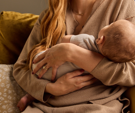 mom holding baby