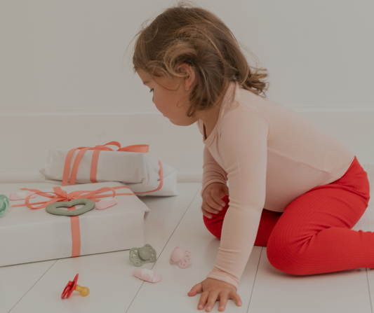 toddler with presents