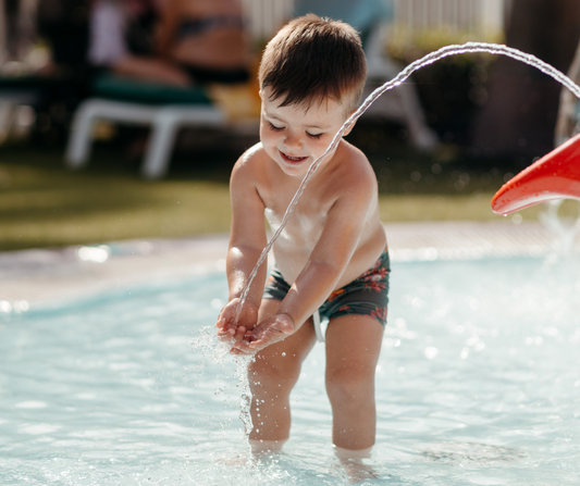 boy playing at the pool