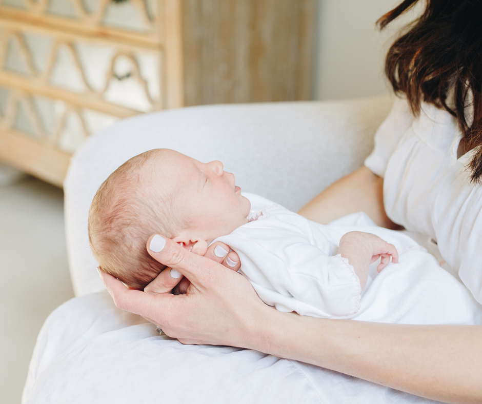 Morgan holding newborn
