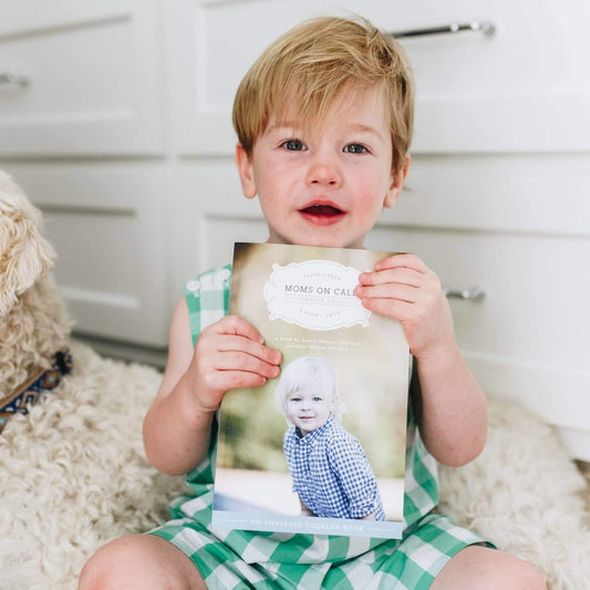 toddler holding toddler book