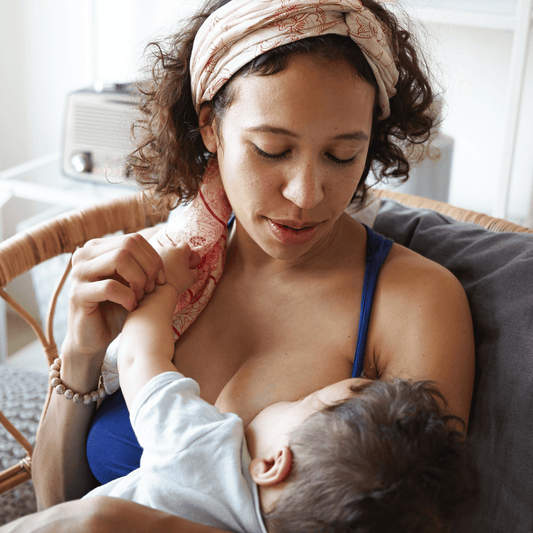 4 month old baby nursing with mom