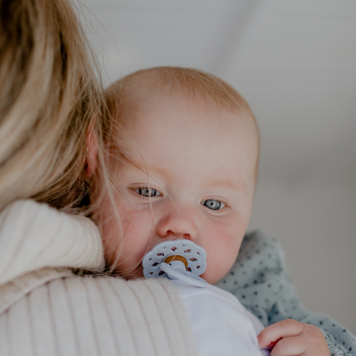 mom holding her baby