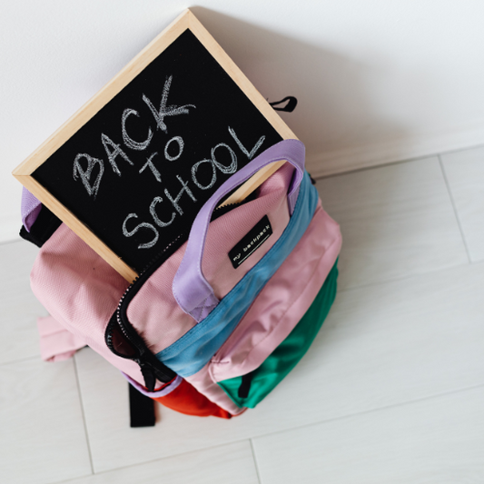 book bag with back to school sign