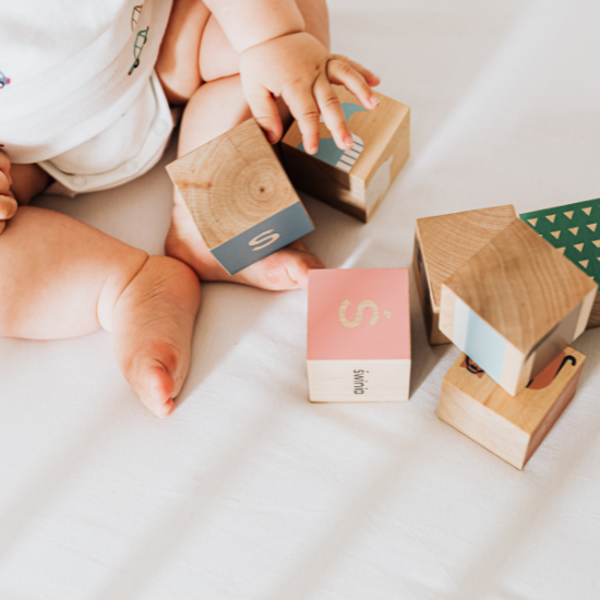 baby playing with blocks