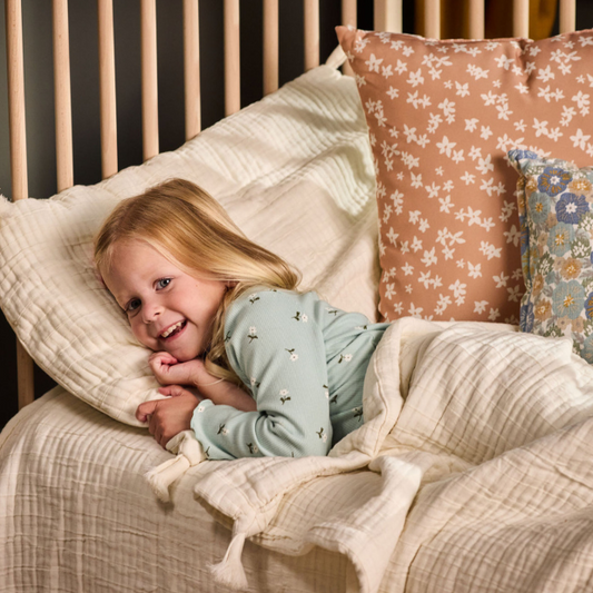 Toddler sleeping in bed