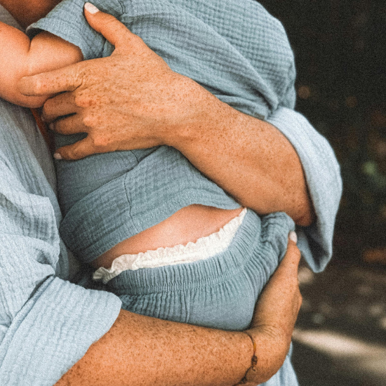 mom holding baby 