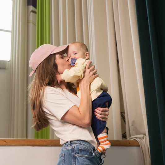 mom holding baby