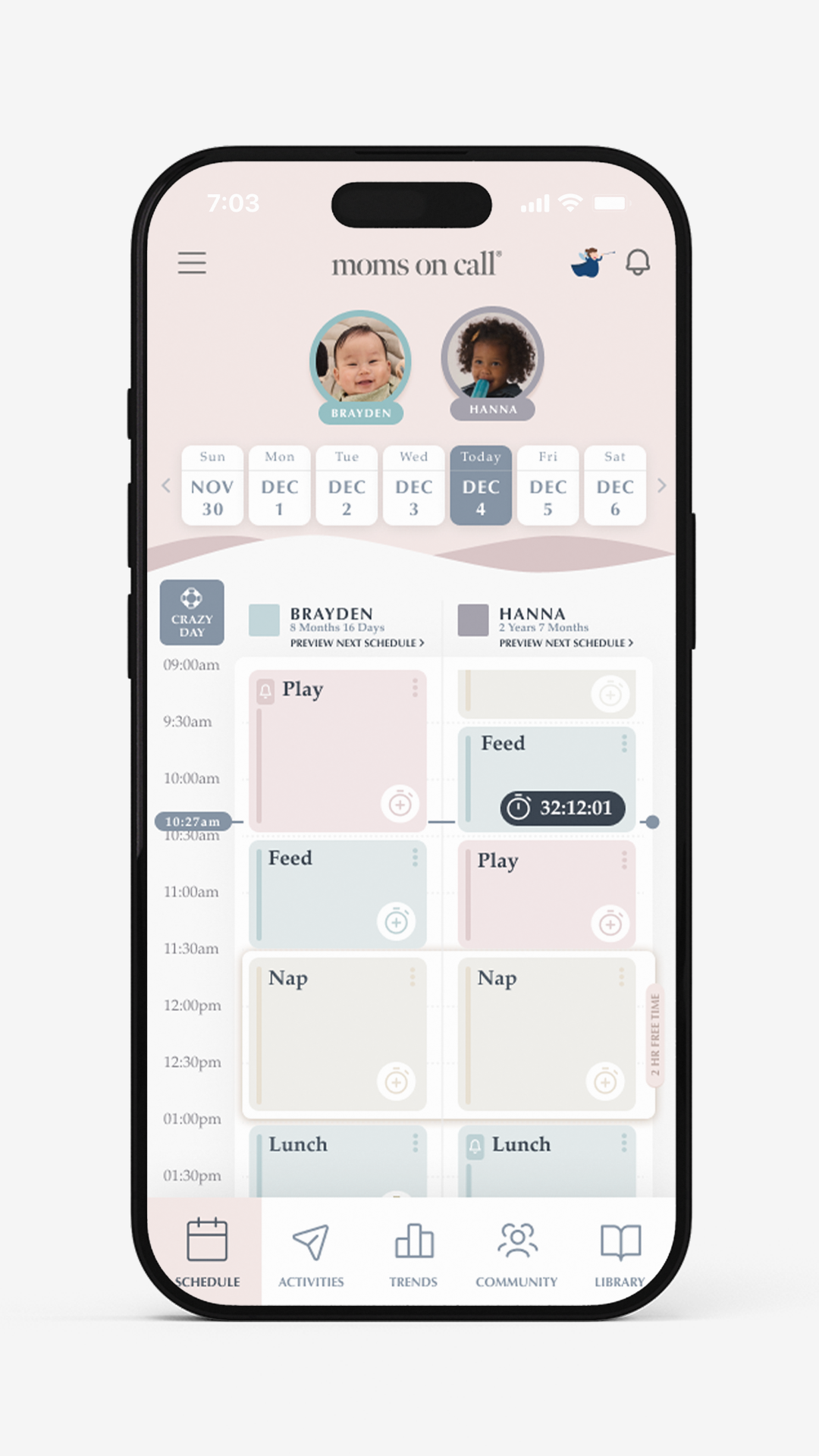 Phone screen displaying moms on call childcare app with baby monitoring features.