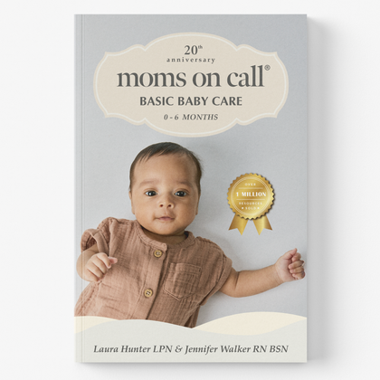 Book titled '20th Anniversary moms on call Basic Baby Care' with a baby on the cover