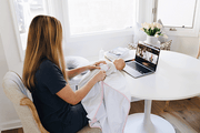 Mother learning how to swaddle a baby with Moms on Call online course