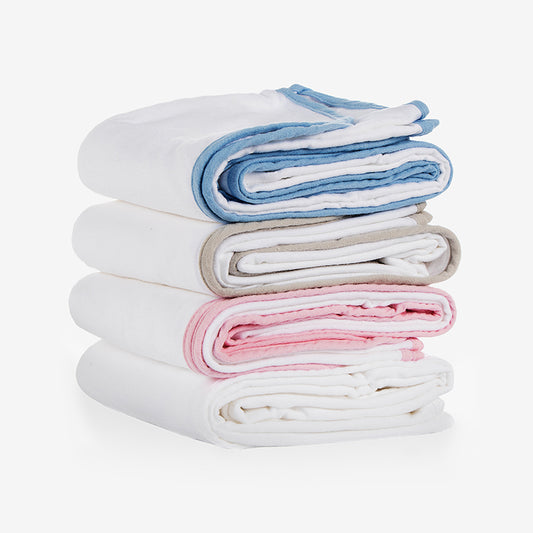 A stack of neatly folded soft towels in white, blue, gray, and pink colors 4