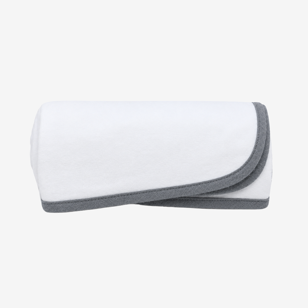 A folded white Moms on Call baby swaddle with a contrasting dark gray border, shown on a clean white background.