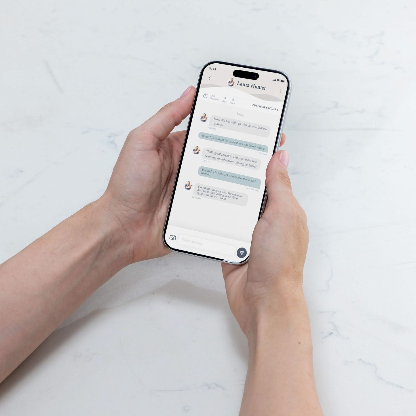 Person holding a smartphone with The Moms on Call App