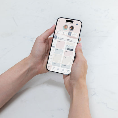 Person holding a smartphone with The Moms on Call App schedule