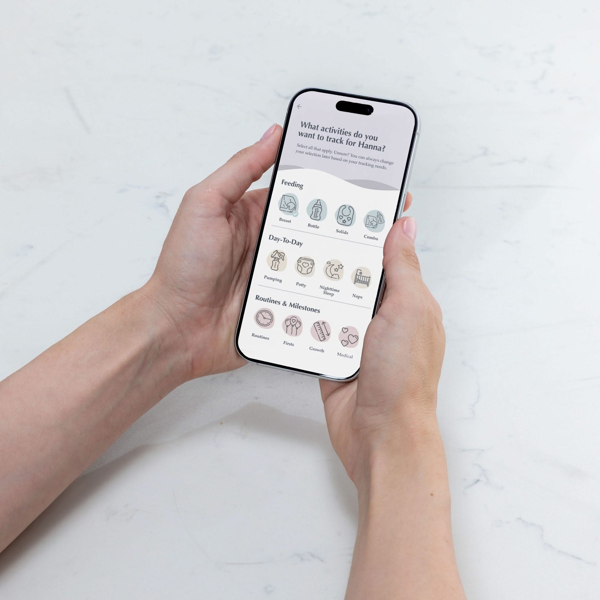 Person holding a smartphone with The Moms on Call App activities
