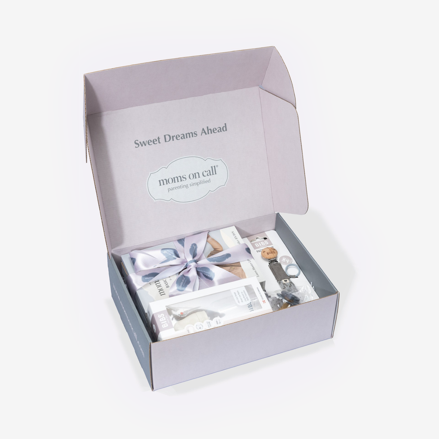 Gift box with baby products and 'Sweet Dreams Ahead' text on a white background