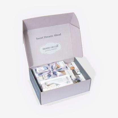 Gift box with baby products and 'Sweet Dreams Ahead' text on a white background