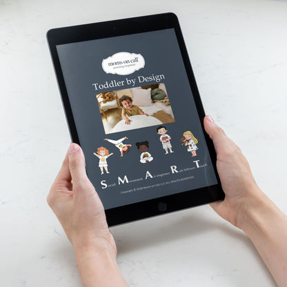 Person holding a tablet displaying 'Moms on Call' app with toddler illustrations.